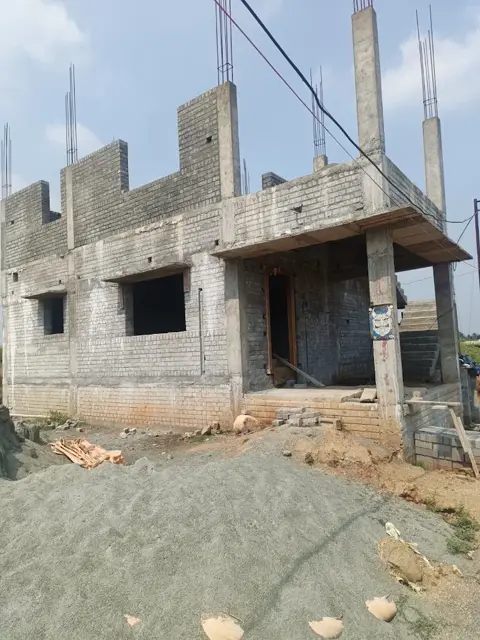 Brick and concrete building structure under construction